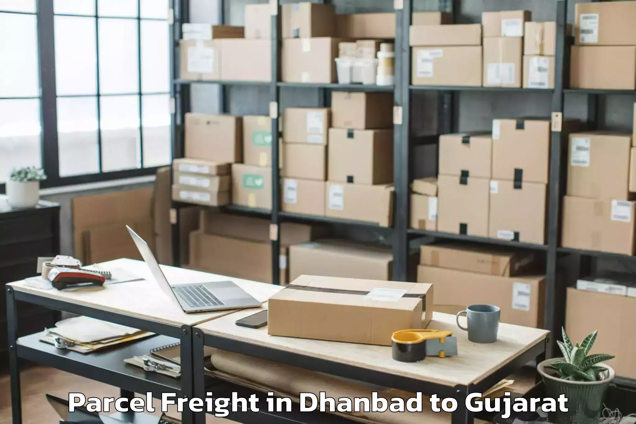 Discover Dhanbad to Upleta Parcel Freight